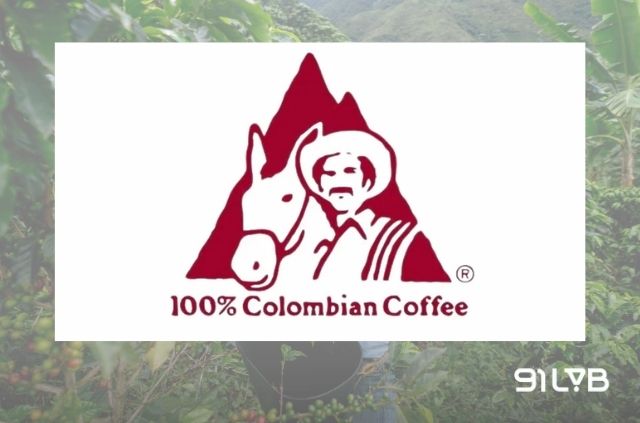 Logo biểu tượng của Café de Colombia, đại diện cho Liên đoàn Những người trồng Cà phê Quốc gia Colombia.